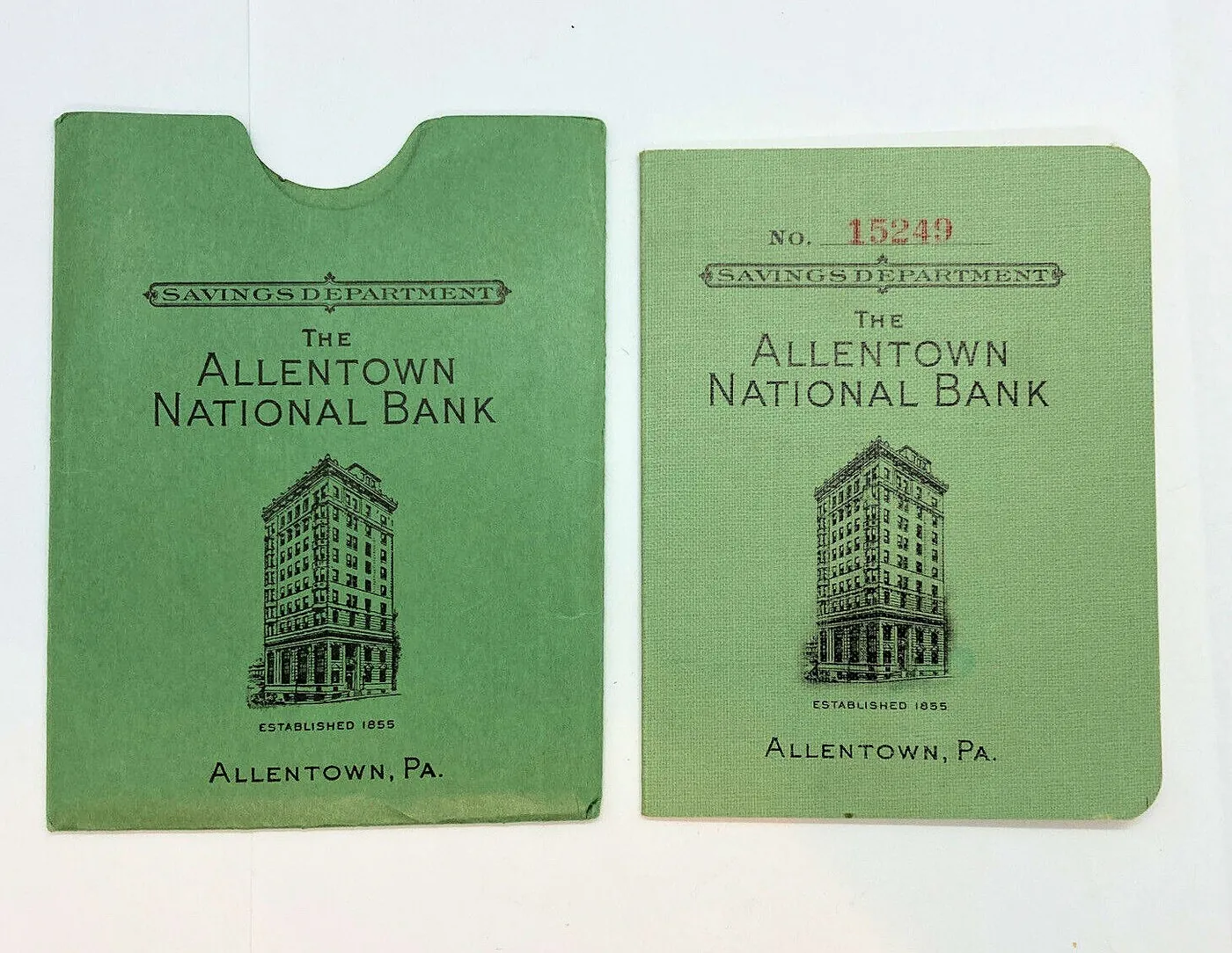 A 1953 savings passbook from the Allentown National Bank, next to its paper sleeve.