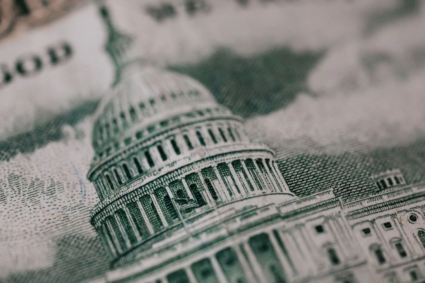A close view of the United States Capitol engraved on a fifty-dollar bill.