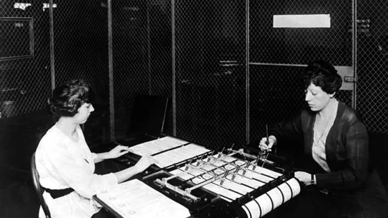 No copyright restriction Two clerks operate a check-signing machine at the War Risk Bureau in Washington, in 1917.