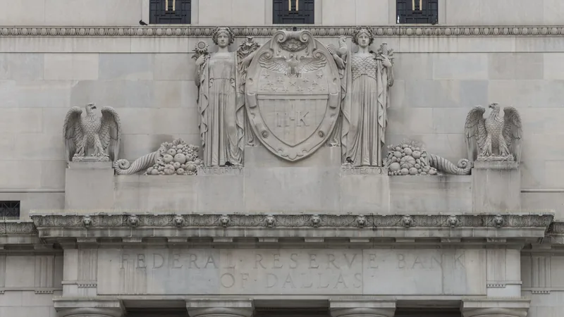 No copyright restriction The stone entrance of the 1920 Federal Reserve Bank building in Dallas, with Integrity and Protection carved under the figures.