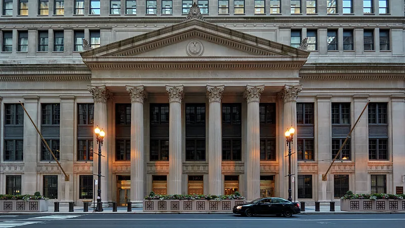 The columned facade of the Federal Reserve Bank of Chicago, with the bank&rsquo;s name carved above the entrance.