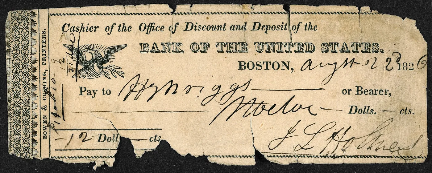 No copyright restriction An old paper check from the Bank of the United States, filled out by hand.