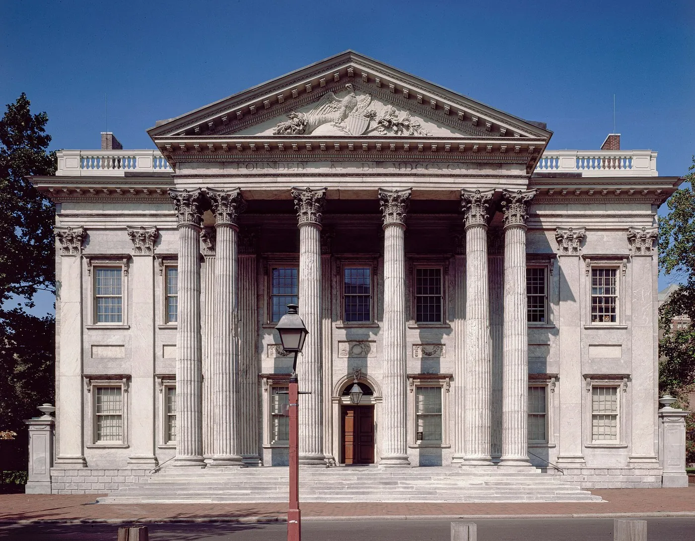 The First Bank of the United States in Philadelphia, a stone building with Corinthian columns.