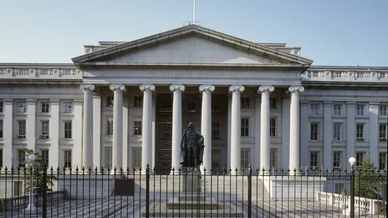 The south facade of the U.S. Treasury Building in Washington, with THE TREASURY DEPARTMENT carved above the columns.